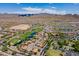 Expansive aerial view of a Primary-planned community featuring a golf course and mountain backdrop at 26071 W Sequoia Dr, Buckeye, AZ 85396