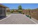 Backyard featuring a low-maintenance gravel area and a charming, landscaped wall for added privacy at 26071 W Sequoia Dr, Buckeye, AZ 85396