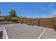 Private backyard featuring a low-maintenance gravel area, perfect for outdoor activities and relaxation at 26071 W Sequoia Dr, Buckeye, AZ 85396