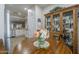 View of dining nook area with view into traditional kitchen and white cabinets at 26071 W Sequoia Dr, Buckeye, AZ 85396