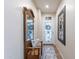Inviting entryway featuring a decorative mirror, bench seating, and a stylish patterned rug at 26071 W Sequoia Dr, Buckeye, AZ 85396