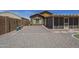 Exterior view with desert landscaping, gravel beds, and an enclosed patio at 26071 W Sequoia Dr, Buckeye, AZ 85396