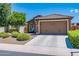 Charming single-story home with stone accents, a well-maintained front yard, and a two-car garage at 26071 W Sequoia Dr, Buckeye, AZ 85396