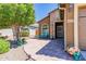 Inviting front porch with brick pavers, bench seating, decorative accents, and a well-maintained exterior at 26071 W Sequoia Dr, Buckeye, AZ 85396