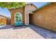 Inviting front porch with brick pavers, bench seating, decorative accents, and a well-maintained exterior at 26071 W Sequoia Dr, Buckeye, AZ 85396