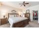 Relaxing main bedroom boasting a ceiling fan, comfortable bed, and convenient walk-in closet at 26071 W Sequoia Dr, Buckeye, AZ 85396