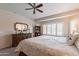 Serene main bedroom showcases neutral tones, a comfortable bed, and elegant dresser at 26071 W Sequoia Dr, Buckeye, AZ 85396