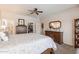 Well-appointed main bedroom with a closet, dressers, and view into the main bathroom at 26071 W Sequoia Dr, Buckeye, AZ 85396