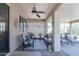 Relaxing covered patio with ceiling fan, stylish furniture, and neutral color scheme at 26071 W Sequoia Dr, Buckeye, AZ 85396