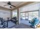 Inviting screened-in patio with comfortable seating and view of outdoor space at 26071 W Sequoia Dr, Buckeye, AZ 85396