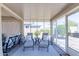 Enclosed patio featuring lounge chairs, tile floors, and view of the backyard at 26071 W Sequoia Dr, Buckeye, AZ 85396