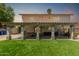 Inviting backyard showcasing a covered patio, lush artificial grass, and ample space for outdoor entertainment at 2643 E Menlo St, Mesa, AZ 85213