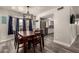 Dining area featuring new flooring and stylish chandelier at 2643 E Menlo St, Mesa, AZ 85213