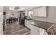 Modern kitchen featuring stainless steel appliances, white cabinets, and stylish countertops at 2643 E Menlo St, Mesa, AZ 85213
