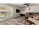 Comfortable living room with sliding glass doors to the backyard at 2643 E Menlo St, Mesa, AZ 85213