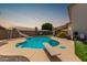 Backyard pool features a diving board and slide, perfect for summer fun at 2643 E Menlo St, Mesa, AZ 85213