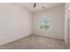 Bright bedroom featuring an arched window and ceiling fan at 26860 N 102Nd Ln, Peoria, AZ 85383