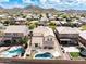 Aerial view of homes featuring pools, backyards and a mountain backdrop at 29339 N 67Th Ave, Peoria, AZ 85383
