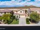 Aerial view of the property showcasing the landscaping, driveway, and roof at 29339 N 67Th Ave, Peoria, AZ 85383