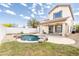 Nice backyard featuring a pool, rock features, grassy area and perimeter fence at 29339 N 67Th Ave, Peoria, AZ 85383