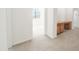 Light-filled home office space with beautiful built-in wood desk at 29339 N 67Th Ave, Peoria, AZ 85383