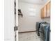 Spacious laundry room features side-by-side washer and dryer and plenty of storage space at 29339 N 67Th Ave, Peoria, AZ 85383
