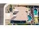 This aerial perspective highlights the home's roof, a private backyard oasis featuring a pool, spa, and patio for serene outdoor living at 3256 E Maplewood St, Gilbert, AZ 85297