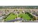 Aerial view of a community park with a large green field, playground, and parking lot at 3256 E Maplewood St, Gilbert, AZ 85297