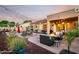 Inviting backyard with pool, fire pit, lounge chairs, and covered patio perfect for outdoor entertaining at 3256 E Maplewood St, Gilbert, AZ 85297