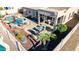 A cozy covered patio with comfortable seating and an outdoor dining area, perfect for enjoying backyard views and entertaining guests at 3256 E Maplewood St, Gilbert, AZ 85297