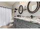 Bathroom features double sinks, decorative mirrors, and modern fixtures at 3256 E Maplewood St, Gilbert, AZ 85297