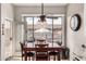 Bright dining area featuring a ceiling fan and views of the backyard at 3256 E Maplewood St, Gilbert, AZ 85297