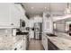 Well-lit kitchen featuring stainless steel appliances, granite countertops, and a convenient center island with bar seating at 3256 E Maplewood St, Gilbert, AZ 85297