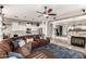 Spacious open floorplan showcasing an inviting living room with a fireplace and adjacent kitchen at 3256 E Maplewood St, Gilbert, AZ 85297
