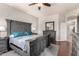 Comfortable main bedroom with dark wood furniture, soft blue accents, and a relaxing atmosphere at 3256 E Maplewood St, Gilbert, AZ 85297