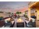 Patio area with fire pit and string lights. The pool area is visible at 3256 E Maplewood St, Gilbert, AZ 85297