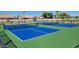 Two outdoor blue pickleball courts set against a green field, perfect for active recreation and community engagement at 3256 E Maplewood St, Gilbert, AZ 85297
