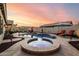 Beautiful backyard pool and spa with colorful LED lighting surrounded by a spacious patio at 3256 E Maplewood St, Gilbert, AZ 85297