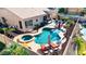Aerial shot showcases a private pool and spa with lounge chairs, complemented by a covered patio and well-maintained landscaping at 3256 E Maplewood St, Gilbert, AZ 85297