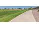 Scenic walking path winds through a green space, providing a peaceful setting for exercise and enjoying the natural surroundings at 3256 E Maplewood St, Gilbert, AZ 85297