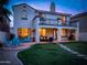 Expansive backyard with patio, lounge furniture, mature trees, and two-story home at 3261 S Sunland Dr, Chandler, AZ 85248
