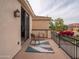 Charming balcony with wrought iron railing, offering outdoor seating and neighborhood views at 3261 S Sunland Dr, Chandler, AZ 85248