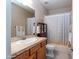 Neutral bathroom features a tub and shower combo, tile floor, and framed mirror at 3261 S Sunland Dr, Chandler, AZ 85248