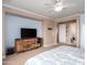 Comfortable bedroom with wooden dresser and balcony access, providing a cozy living space at 3261 S Sunland Dr, Chandler, AZ 85248