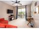 Cozy bedroom with a balcony, desk and red sofa, offering a comfortable and functional space at 3261 S Sunland Dr, Chandler, AZ 85248