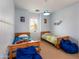 Light blue bedroom with two beds and a window, creating a comfortable and inviting space at 3261 S Sunland Dr, Chandler, AZ 85248