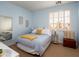 Cozy bedroom with comfortable queen-size bed, neutral walls, and ample natural light at 3261 S Sunland Dr, Chandler, AZ 85248