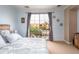 Bright bedroom featuring a balcony and comfortable bed, offering a relaxing space at 3261 S Sunland Dr, Chandler, AZ 85248