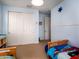 Bright bedroom with two beds, spacious closet, and a light blue color scheme at 3261 S Sunland Dr, Chandler, AZ 85248