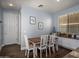Cozy dining area with a wooden table, white chairs, and storage cabinets, perfect for Gathering meals at 3261 S Sunland Dr, Chandler, AZ 85248